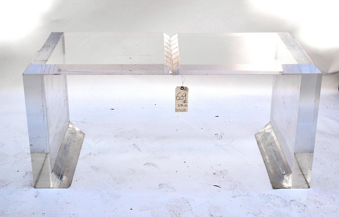 Pair of Modern Clear Acrylic Side Table: Pair of cantilevered clear acrylic side tables with beveled tops. Some scratches and scuffs, otherwise complete. 26" H x 27" x 23 1/2"