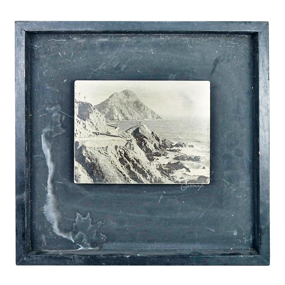 20th C. Etched Metal Coastal Scene Plate: 20th century etched metal plate depicting a coastal scene in a shadowbox frame, with illegible signature ("Gramaya"?). [Plate: 6" H x 8" W; Frame: 14 1/4" H x 15" W]. Marks and wear to plate and frame