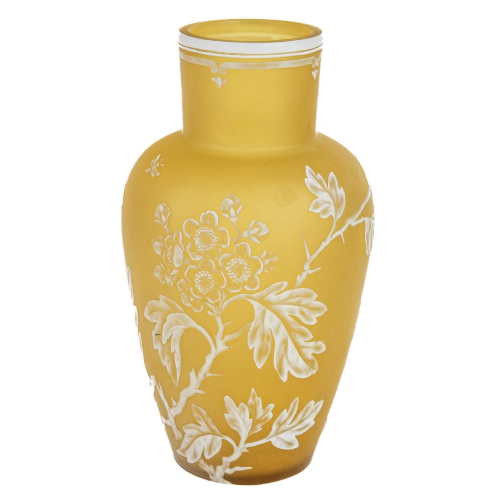 English Cameo Vase Attrib. Thomas Webb & Sons: English cameo vase, wheel-carved, attributed to Thomas Webb & Sons, decorated with fruit tree blossom and leaves, having classic Webb solid border and insect motif. [9" H x 5" Diam.]. Two fleabites to