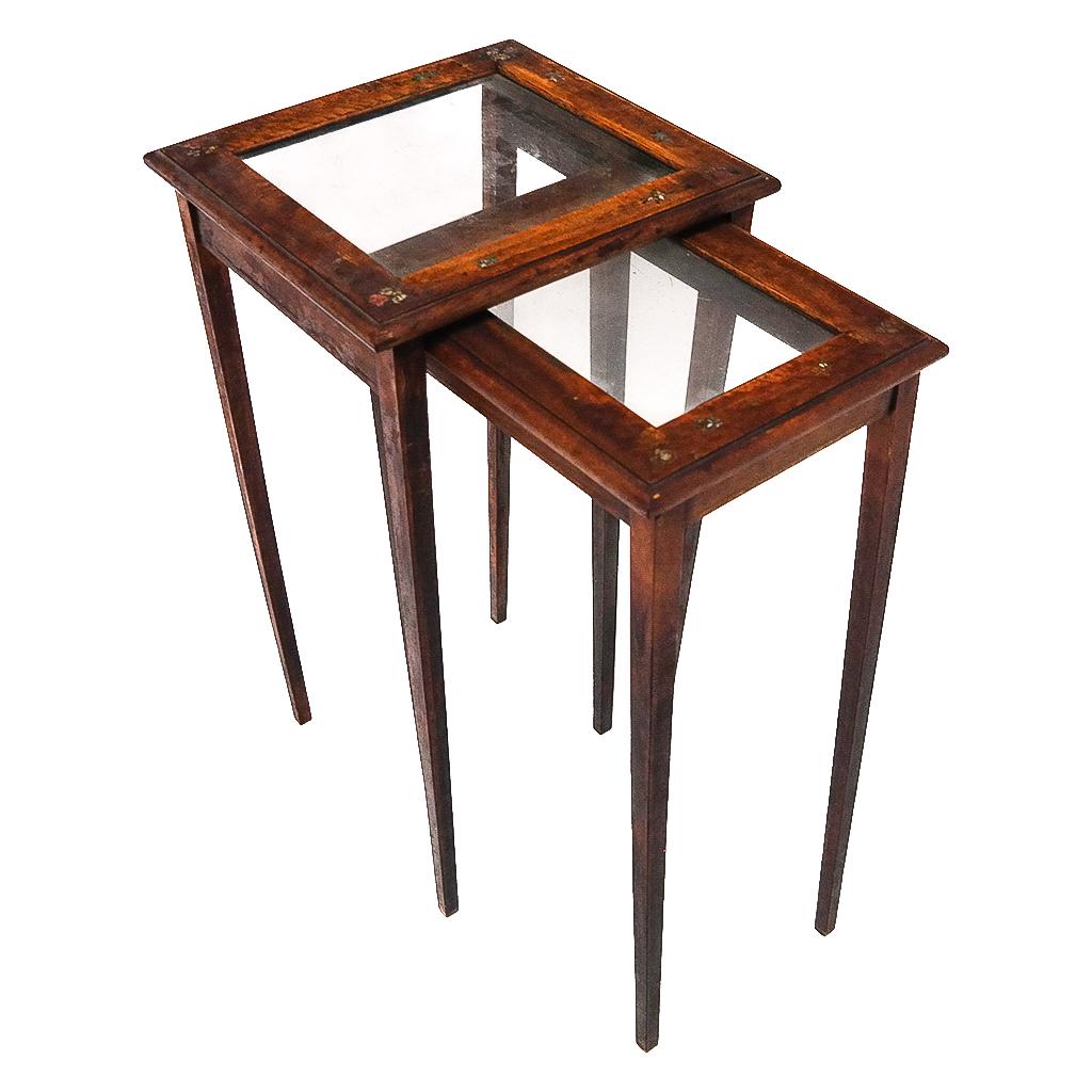 Wood and Glass Nesting Tables: Wood and glass nesting tables with floral paint decoration. [21 1/2" H x 11 1/2" W x 11 1/2" D]. Scuffs and marks; wear to decoration.