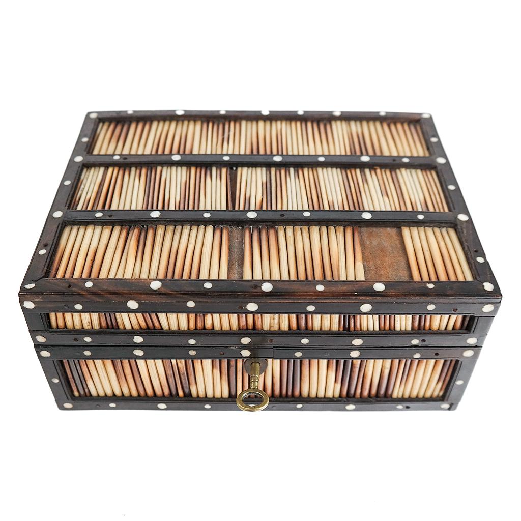 Anglo-Indian Quill Box and Key: Of hardwood and bone inlays. Decorative panel to inside lid. Lock functional. [3 1/4 x 8 x 5 3/4 inches]. Quills missing to top and right-hand side, otherwise in overall good condition.
