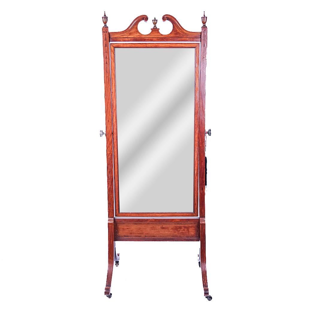 Edwardian Satinwood Flower Inlay Cheval Mirror: Early 20th century Edwardian satinwood bell flower inlay cheval mirror having three urn finials on casters, circa 1910-1920. [75" H x 27 1/2" W x 23" D]. Broken arch top.