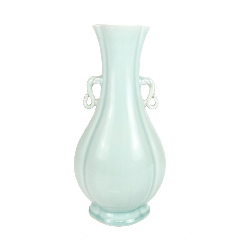 20th C. Chinese Celadon Vase: Early 20th century porcelain vase with elephant-form handle. [14" H x 3 3/4" W x 3 1/2" D]. In good condition.