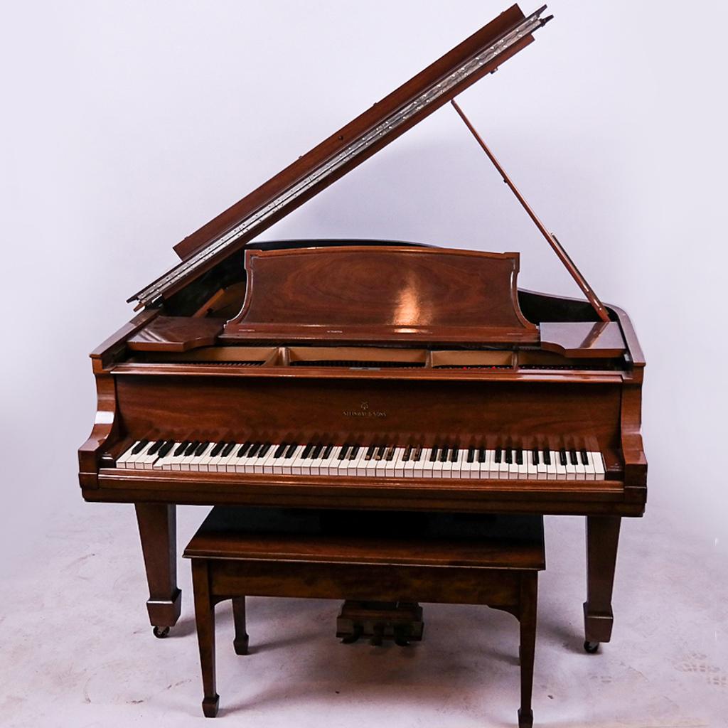 Steinway Grand Piano, Model L: Steinway walnut grand piano, Model L, serial number 225536. Built 1924. Plastic keys. With bench. [5 ft 10in L x 58 W inches]. Sound board cracked and off the ribs, some veneer missing.
