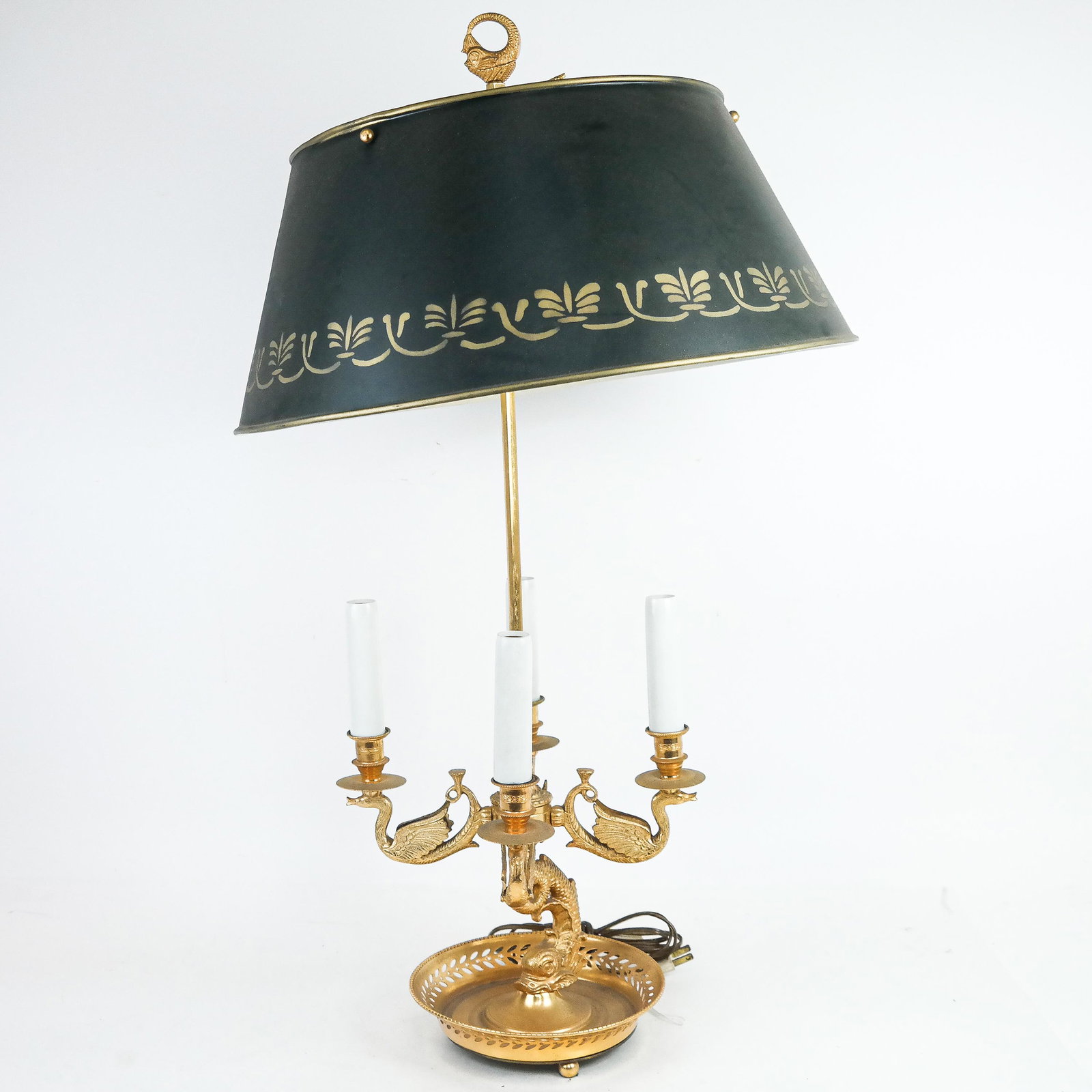 Gilt Metal and Black Tole Lamp: Gilt metal and black tole lamp, late 20th century, in the French taste, having Empire motif swans raised on a Baroque-style dolphin support. [30 1/2" H x 16 3/4" Diam.]. Light dust and wear.