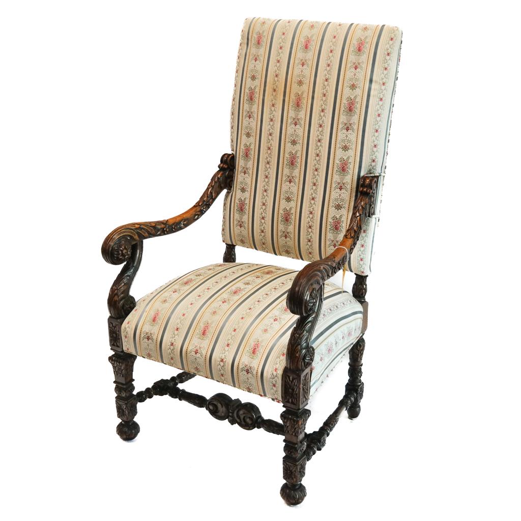 Baroque Revival Carved and Upholstered Armchair: Baroque Revival carved and upholstered armchair. [46" H x 27" W x 25" D]. Wear to fabric and carving; fading; marks.