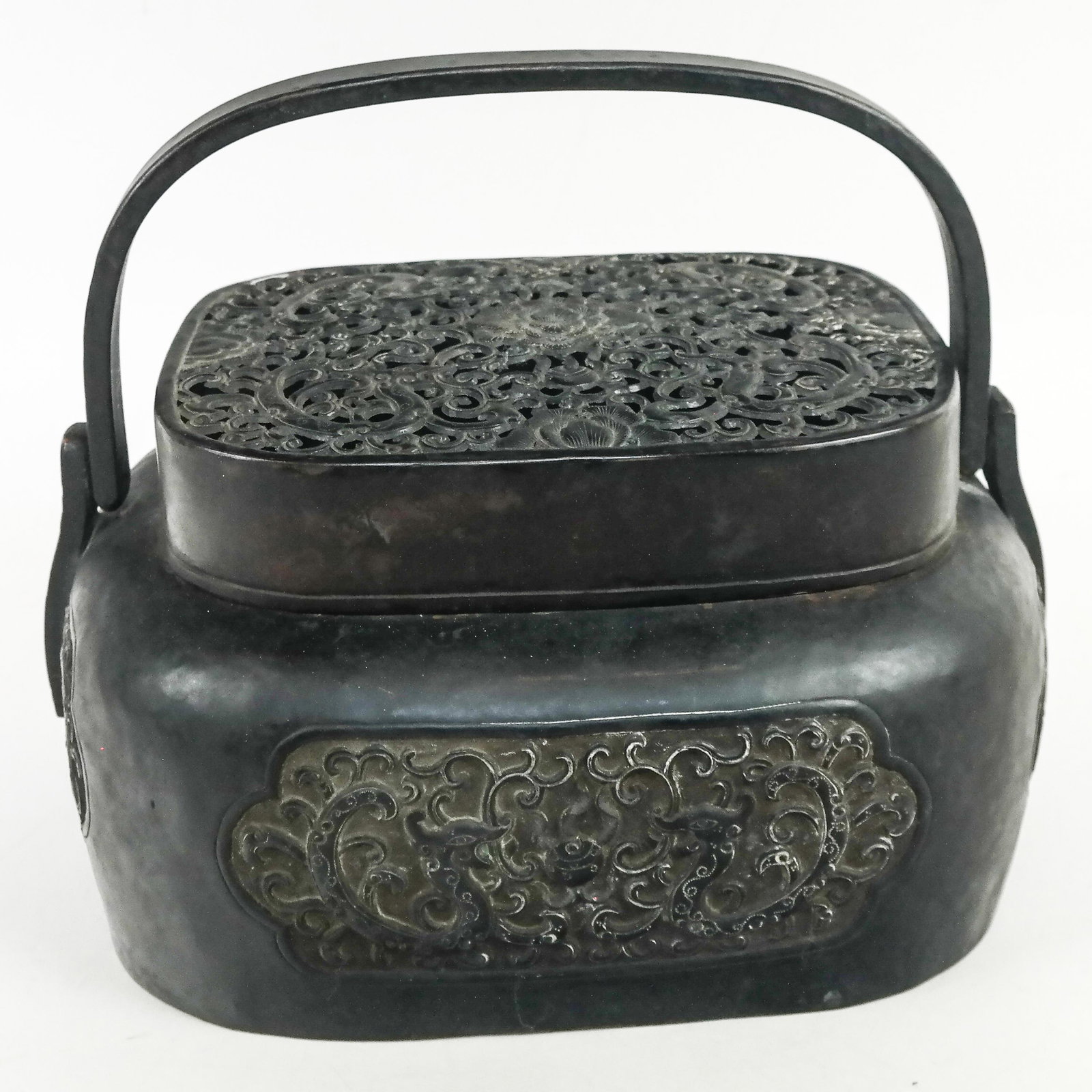 Chinese Bronze Incense Burner / Warmer: Chinese bronze incense burner / warmer with pierced and relief decoration of scrolling floral and dragon motifs, with characters to base. [9" H x 11 1/2" W x 9 1/2" D]. Dents, oxidation, residue and w