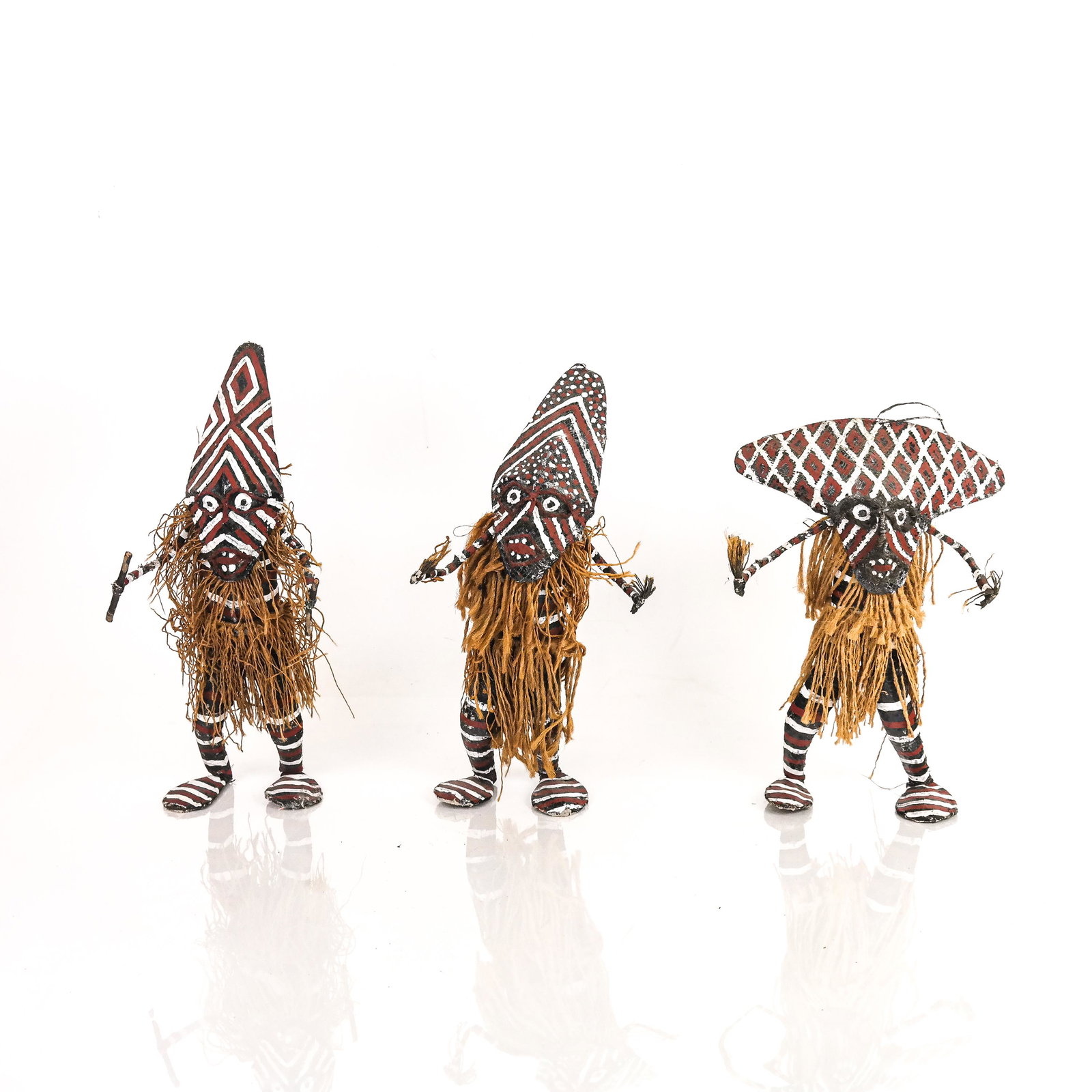 Set of 3 Kuchina-Style Painted Dolls: Set of 3 dolls having painted masks and legs and straw bodies. [12" H].