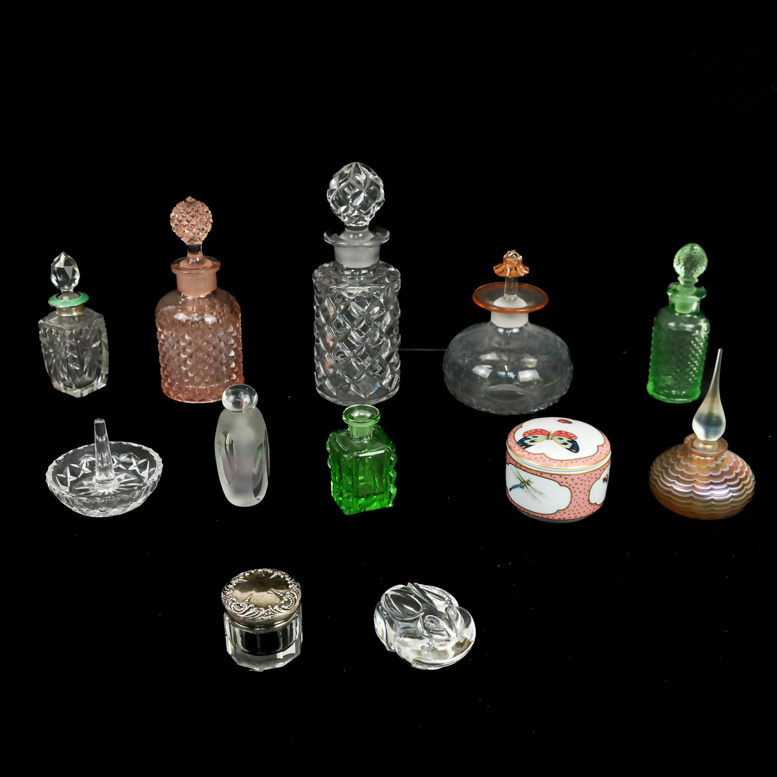 Assembled Group of Trinket & Toiletry Items (12): Assembled group of 12 toiletry and trinket items, 20th century, including glass perfume and scent bottles, pill boxes, ring holder and other items; including Limoges for Tiffany & Co., M. Labarge Fire