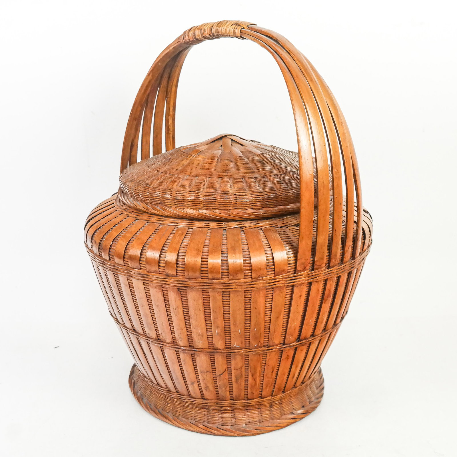Woven Wicker Basket: Woven wicker basket. [16" H x 12" Diam.]. Scattered marks and wear.