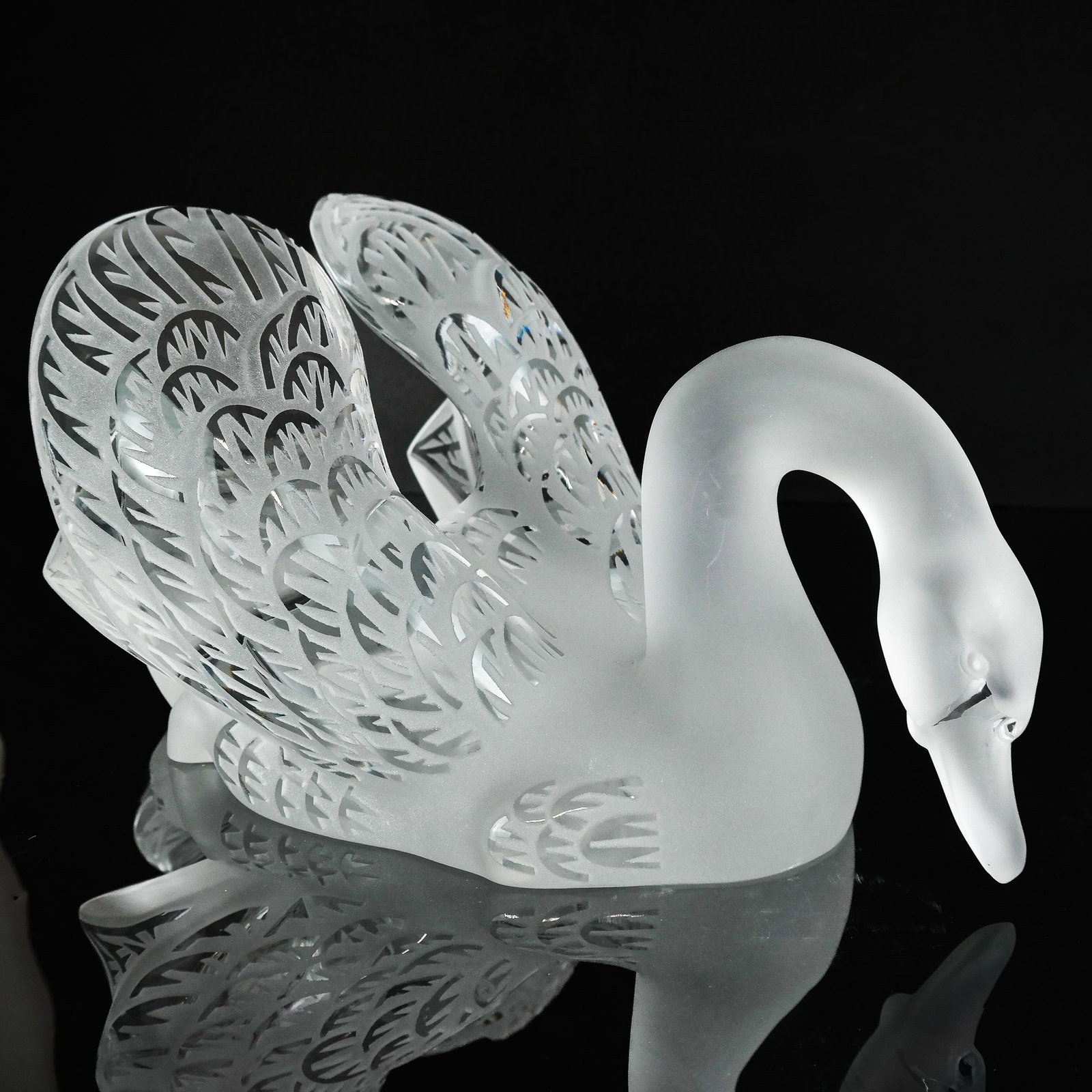 Lalique Glass Swan, Ltd Edition 38/500: Designed by Marie Claude Lalique in her iconic design, in molded and sandblast Lalique crystal. Signed under tail and number. [7 x 14 x 8 1/2 inches]. In very good condition,