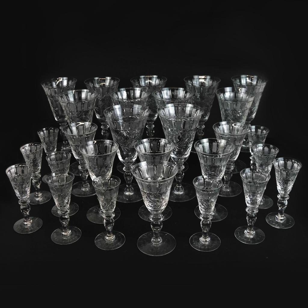 Large Group of T.G. Hawkes Crystal: Large group of T.G. Hawkes crystal, some marked "Hawkes", comprising: 11 red wine glasses, 6 white wine glasses, 11 liqueur glasses, all finely engraved and cut with geometric and floral decoration. 2