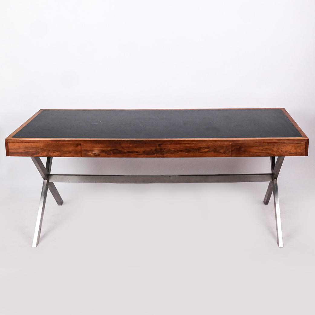 Mid-Century Modern Teak and Chrome Desk: Mid-century modern teak and chrome desk with black inset writing surface, unmarked. [29 1/2" H x 72" W x 30" D]. Stains, fading, scratches, marks and wear.