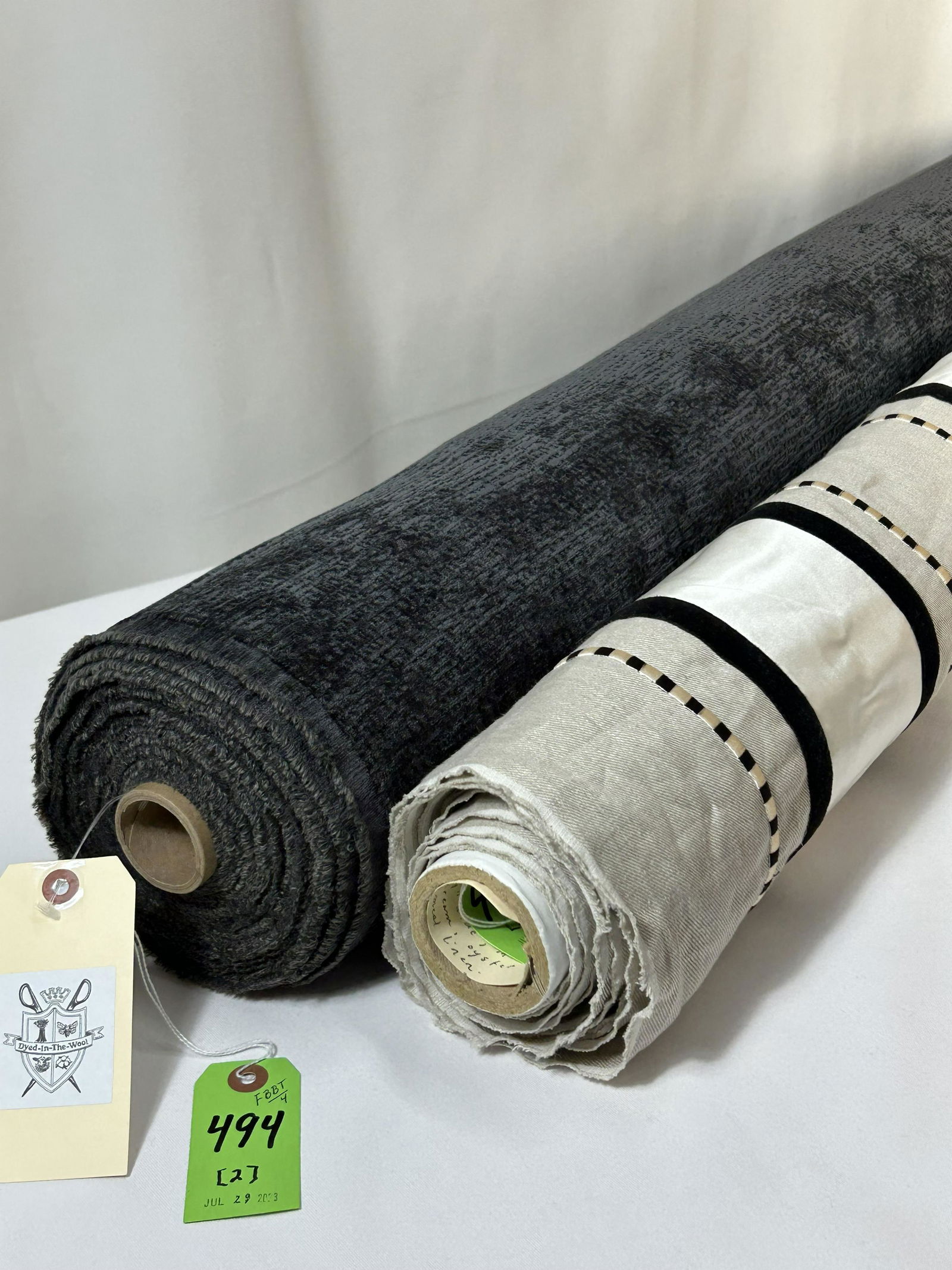 Colefax & Fowler and Designs for Mobility Fabrics: 1) 5 yards of Colefax & Fowler's "Era" applique warp stripe in colorway "Mother of Pearl", Item #L 8899-01, 54" width. The black, cream and oyster silk satin on oatmeal linen ground has a horizontal r