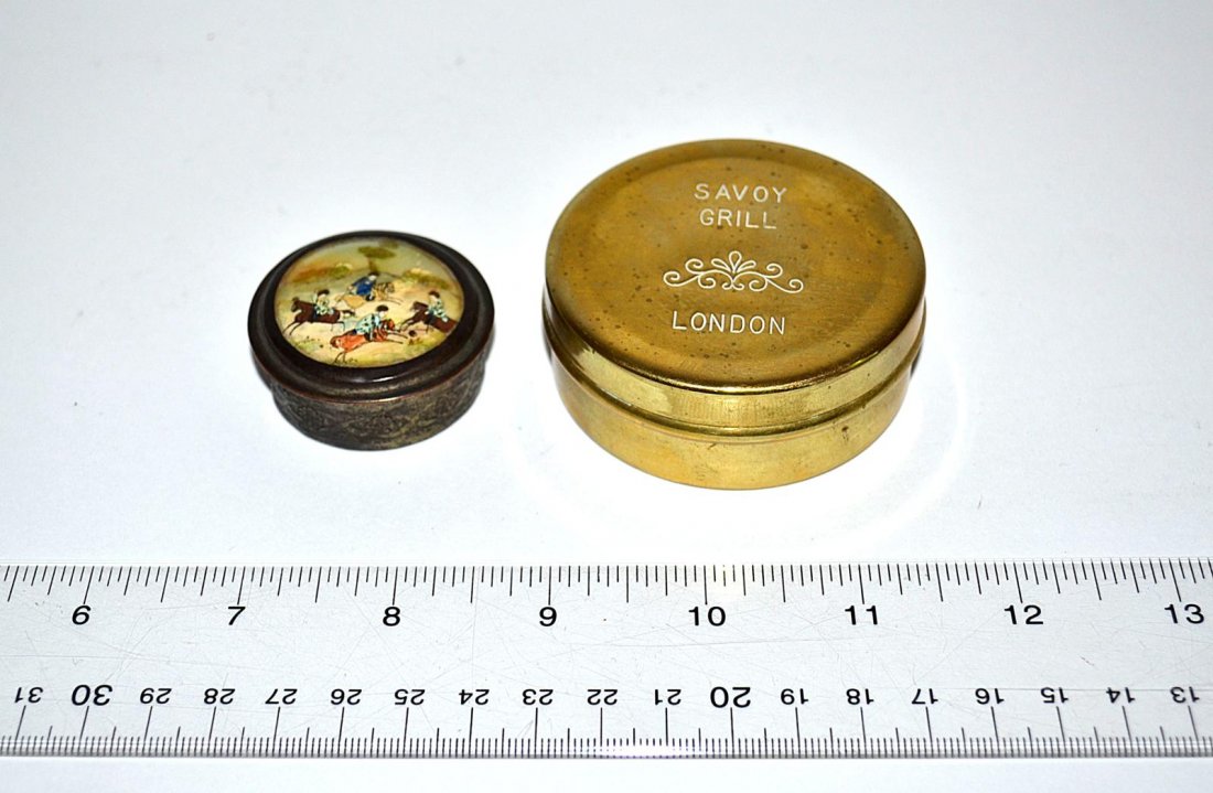 Tobacco Box and Snuff Box [2 pieces]: A brass tobacco box engraved: "Savoy Grill London" together with a Chinese silver-plated snuff box with a mother-of-pearl scenic cover. From the Estate of Arthur Laurents.
