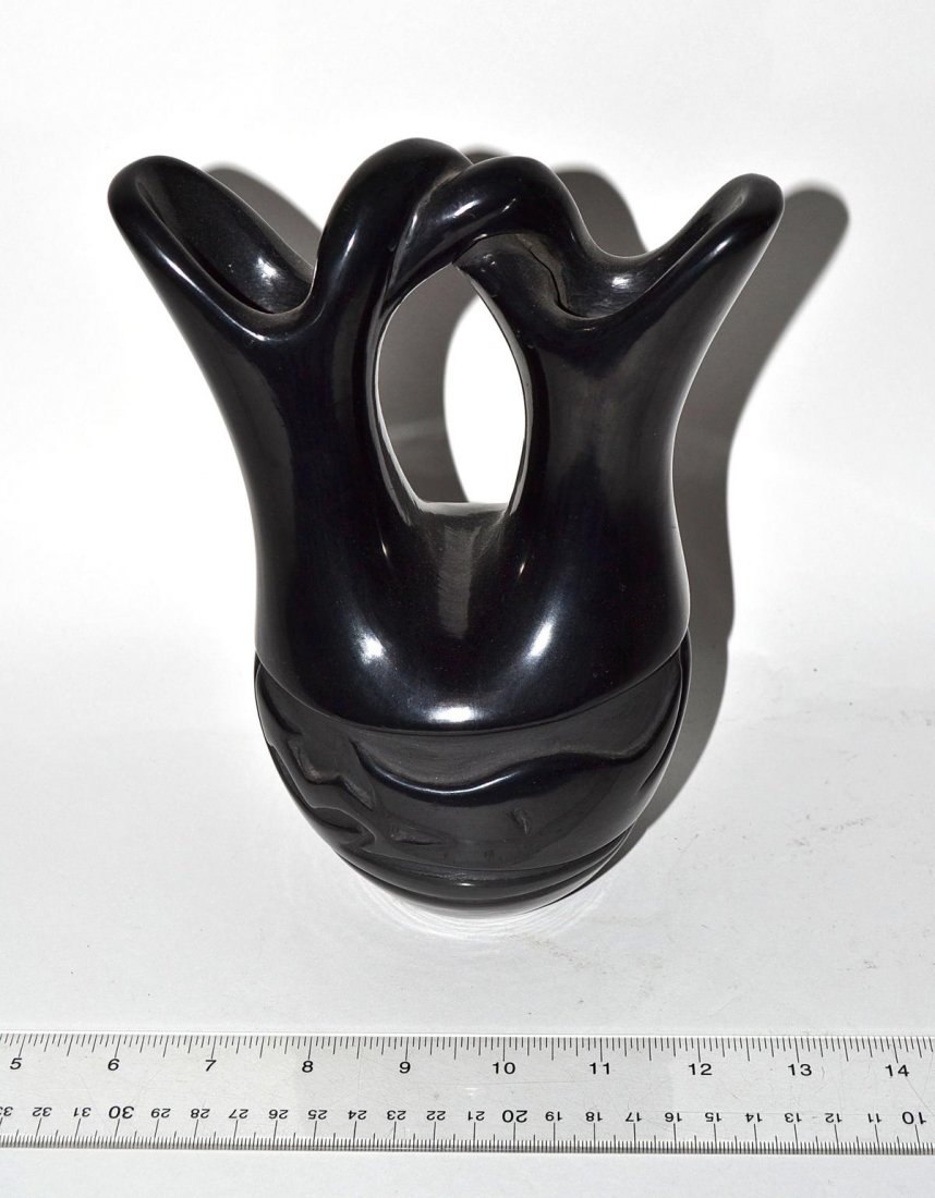 Black Glazed Pottery Vase: A black glazed pottery vase by a Santa Clara. 9" H. In good condition. From the Estate of Arthur Laurents.