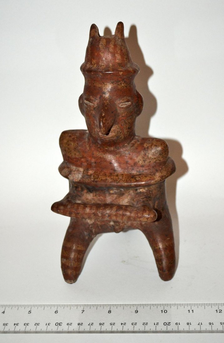 Pre-Columbian Style Pottery Figure: A pre-Columbian style glazed pottery figure. 10" H. In good condition. From the Estate of Arthur Laurents.