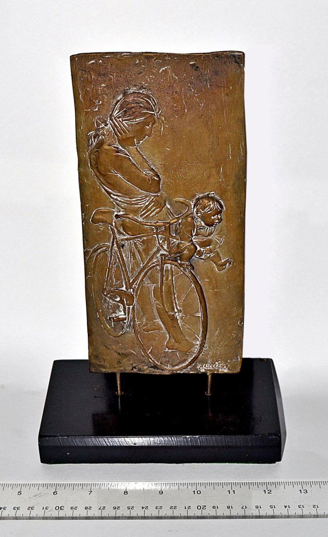 Bronze and Silver Relief, Bruno Lucchesi [1926- ]: A bronze and silver relief on base. Label verso, "Woman and Child on Bicycle, By Bruno Lucchesi, 1970. From Edition of 3, Forum Gallery, 1018 Madison Avenue, New York, N. Y. #5983". 9 7/8" x 4 5/8" [w