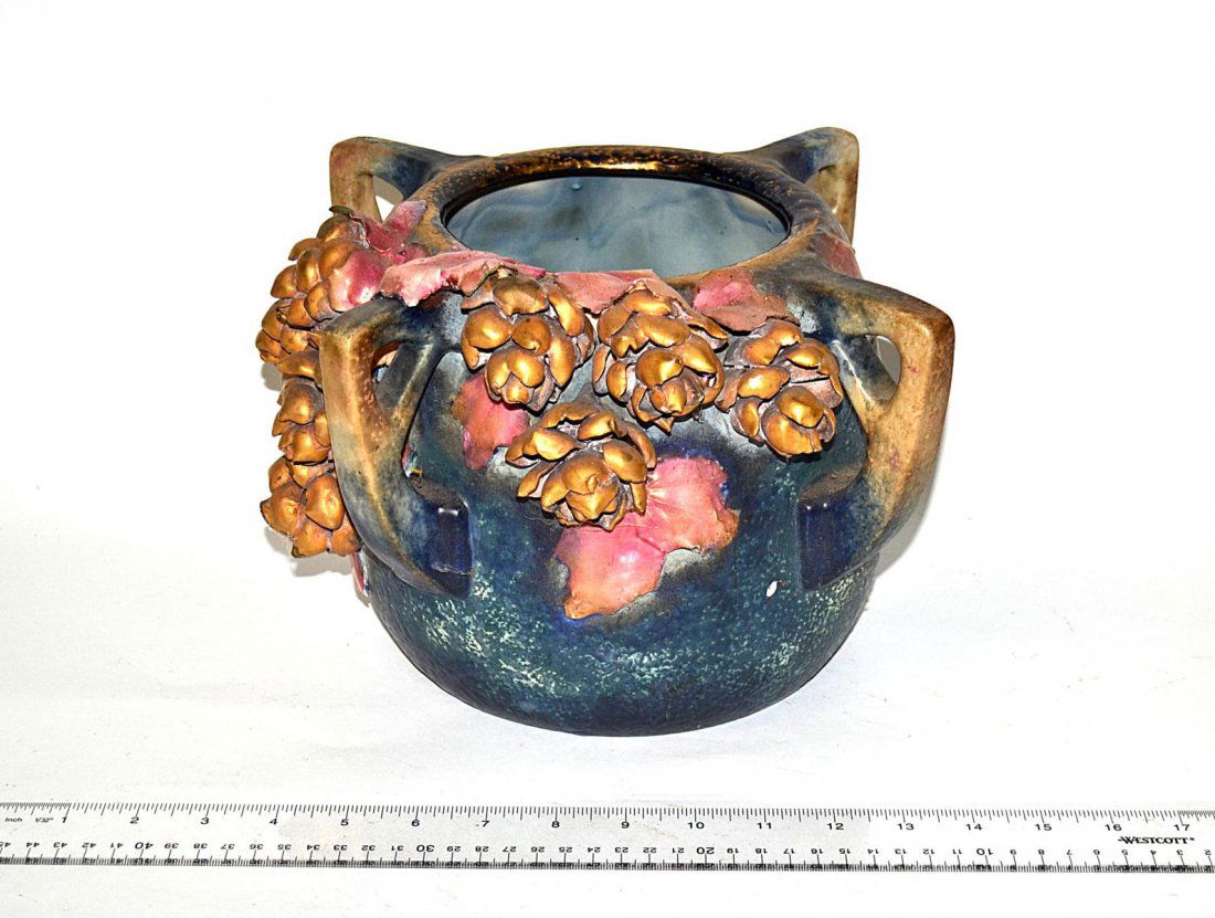Amphora Vase: Art pottery vase having reticulated handles of carved flowers. Losses. 12" Dia.
