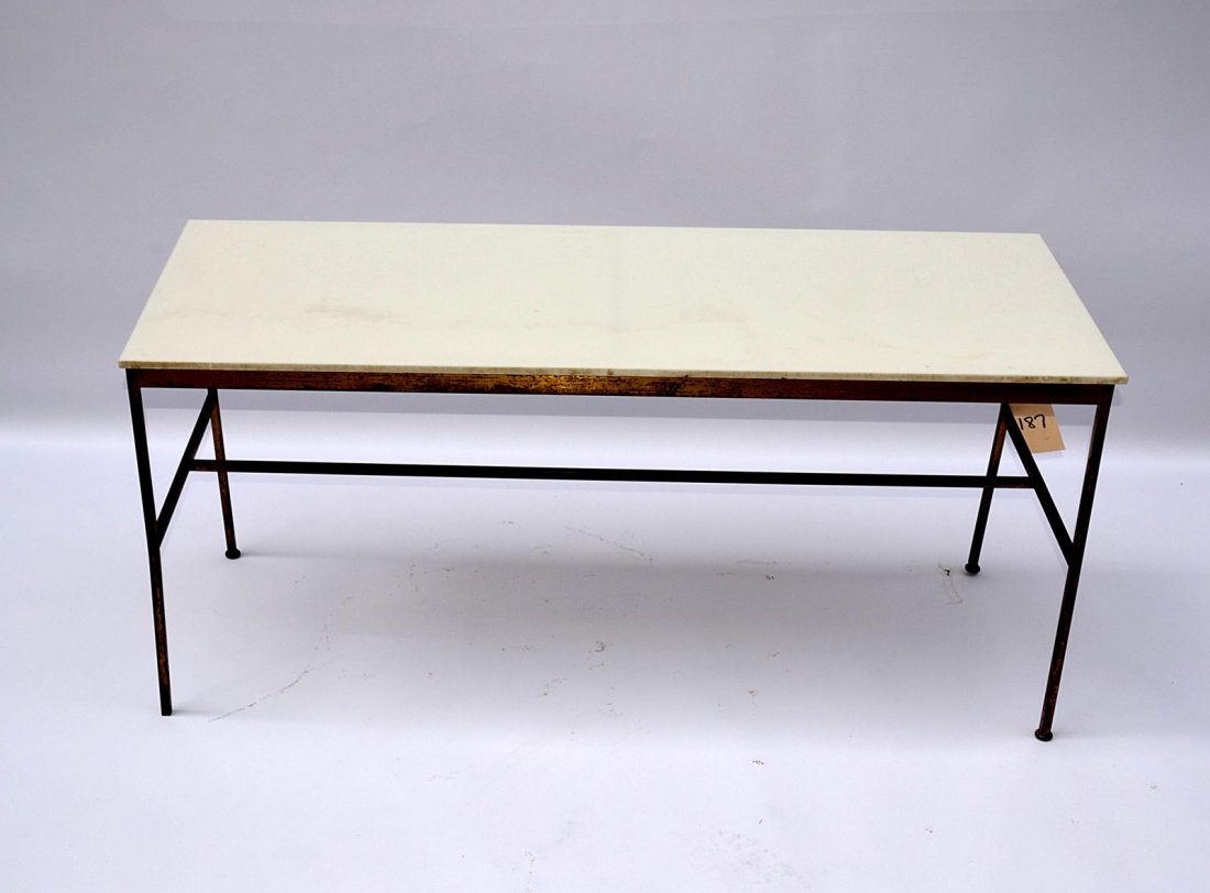 Mid-Century Modern Brass Center Table: A mid-century modern brass cocktail table. Manner of Paul McCobb, American 20th C. Fair condition. From the Estate of Arthur Laurents. 48"W x 18"D x 21.75"H