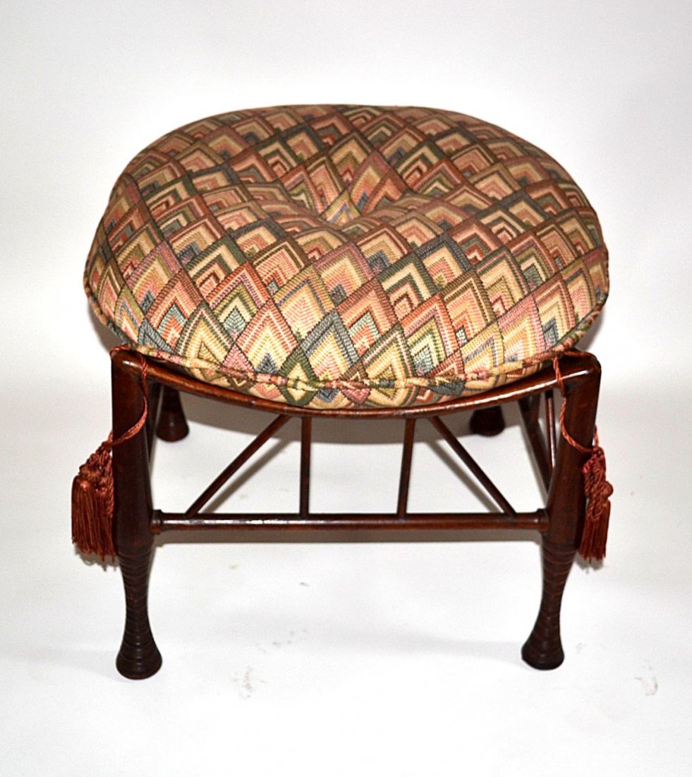 Egyption-Revival Stool: A Egyption-revival walnut stool having an upholstered cushion. American, late 19th C. Good condition. From the Estate of Arthur Laurents.