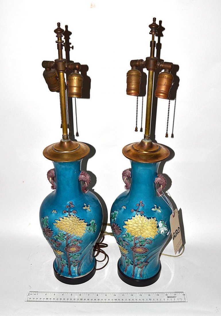 Pair of Minton Turquoise Baluster Vases: Pair of Minton turquoise baluster vases having floral designs and elephant surmounts. Drilled and electrified as lamps, with shades. English, early 20th C. Good condition. From the Estate of Arthur La