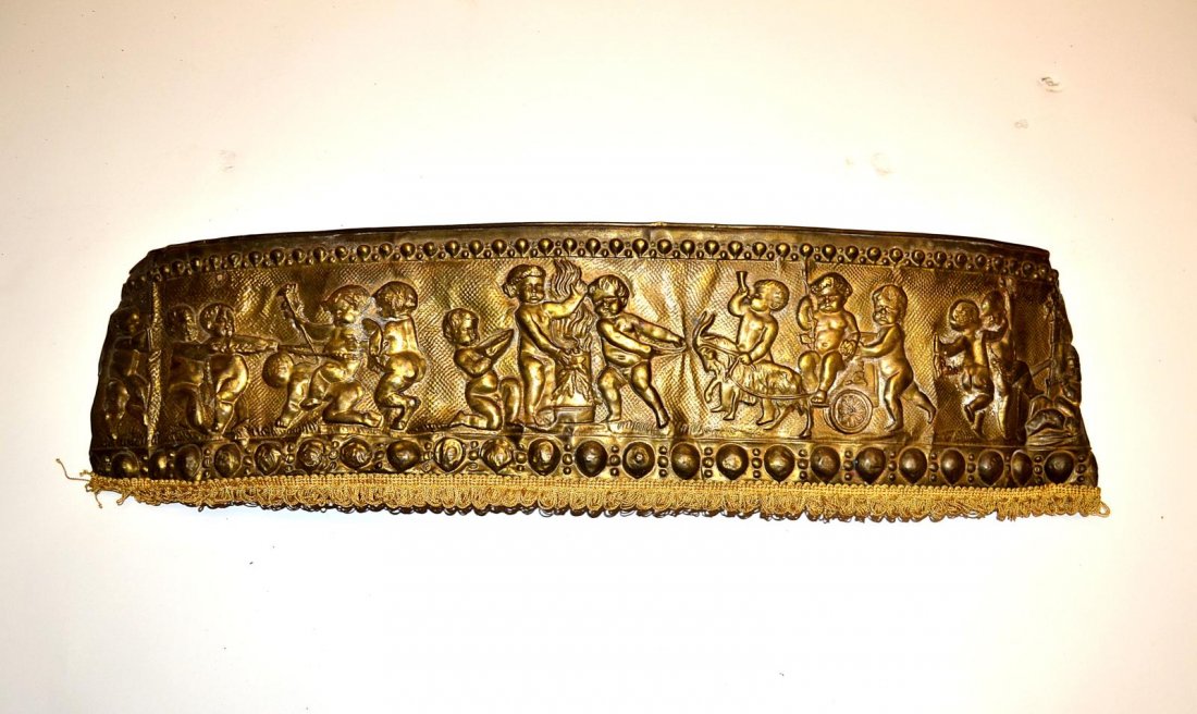 Copper Cherub Valence: Copper valence with cherub relief decoration.