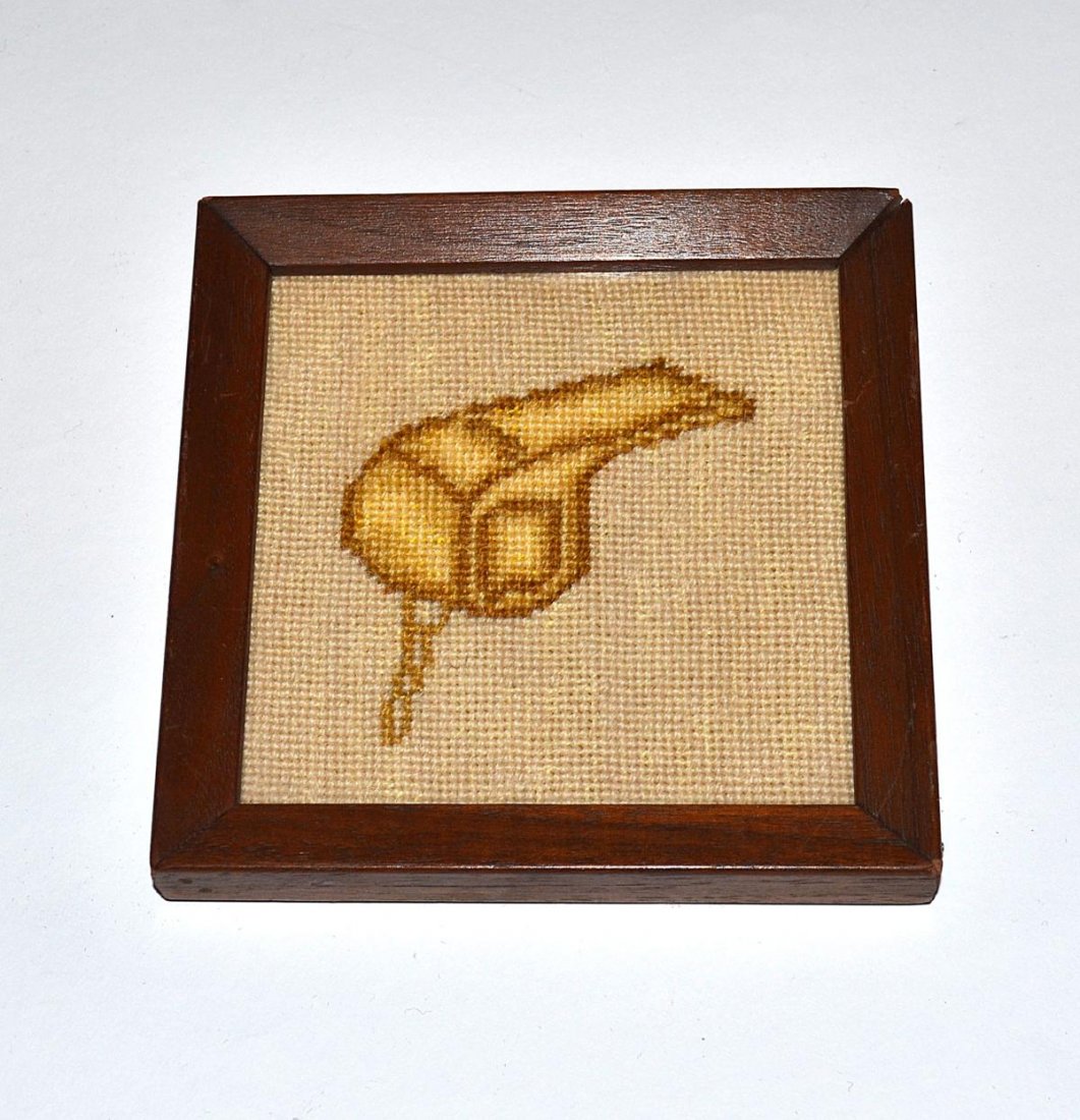 "Anyone Can Whistle" Needlepoint Illustration: 3 3/4" sq depiction of a golden whistle. Mounted and contained under glass in a 4 3/4" sq mahogany frame. In excellent condition. From the Estate of Arthur Laurents.