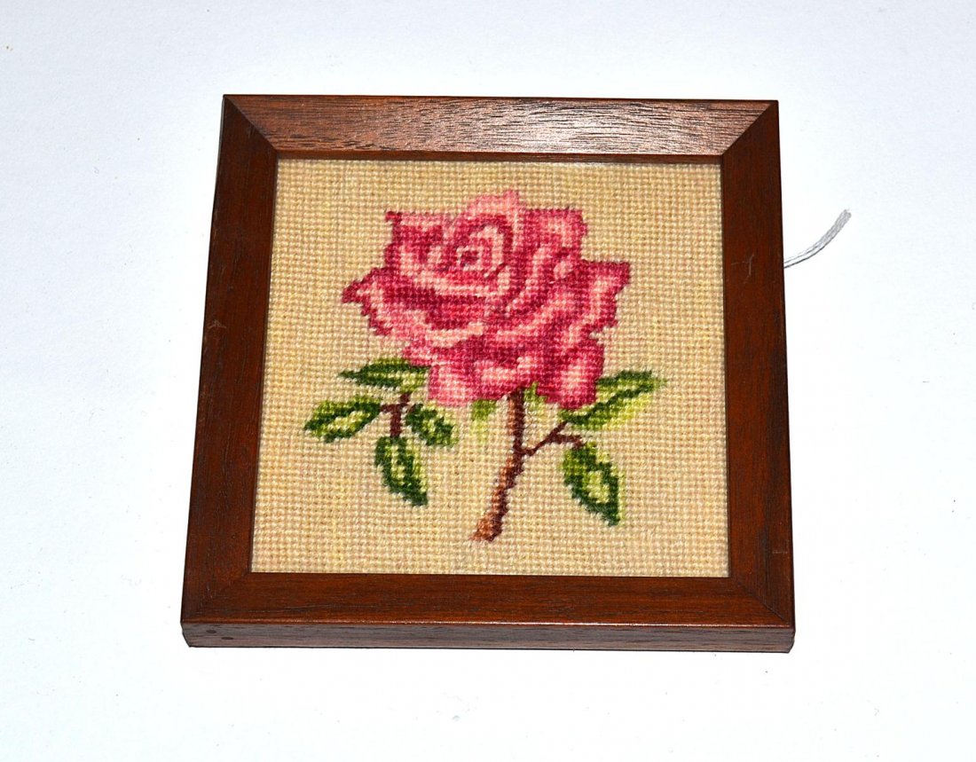 "Gypsy" Needlepoint Illustration: 3 3/4" sq depiction of a cabbage rose with leafy stem. Mounted and contained under glass in a 4 3/4" sq mahogany frame. In excellent condition. From the Estate of Arthur Laurents.