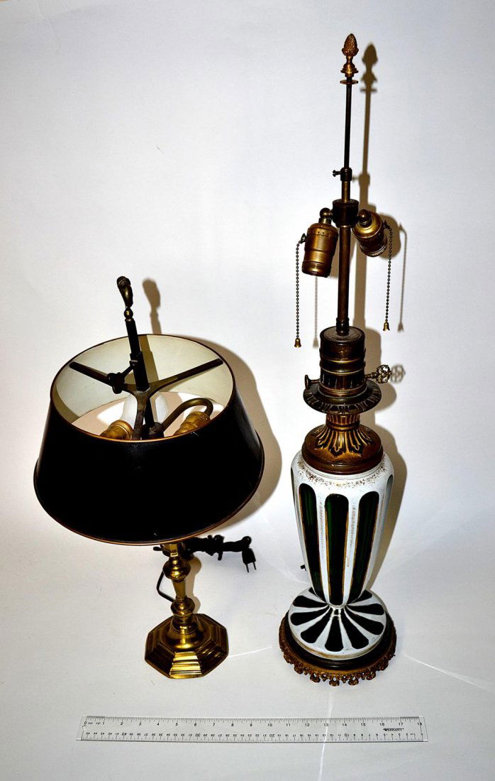 Two Vintage Table Lamps: Comprises a Bohemian cased and cut green glass lamp with lattimo glass overlay. 23" H. Accompanied by a brass lamp with tole shade [as is]. 23 1/2" H.