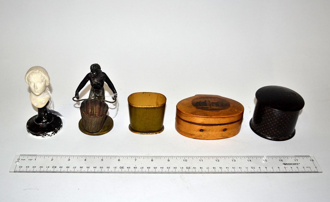 Five Decorations: A female bust on a wood stand, a metal polychrome figure with a basket, two decorated lacquer boxes, and one tole match holder. Various wear. 2 1/4" x 4 1/4"