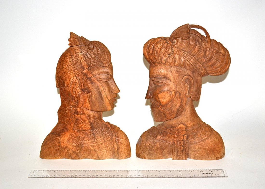 Pair of Carved Wood Busts of Royalty: Depicting a prince and princess, each delicately carved, looking into the other's eyes. From the Estate of Arthur Laurents.