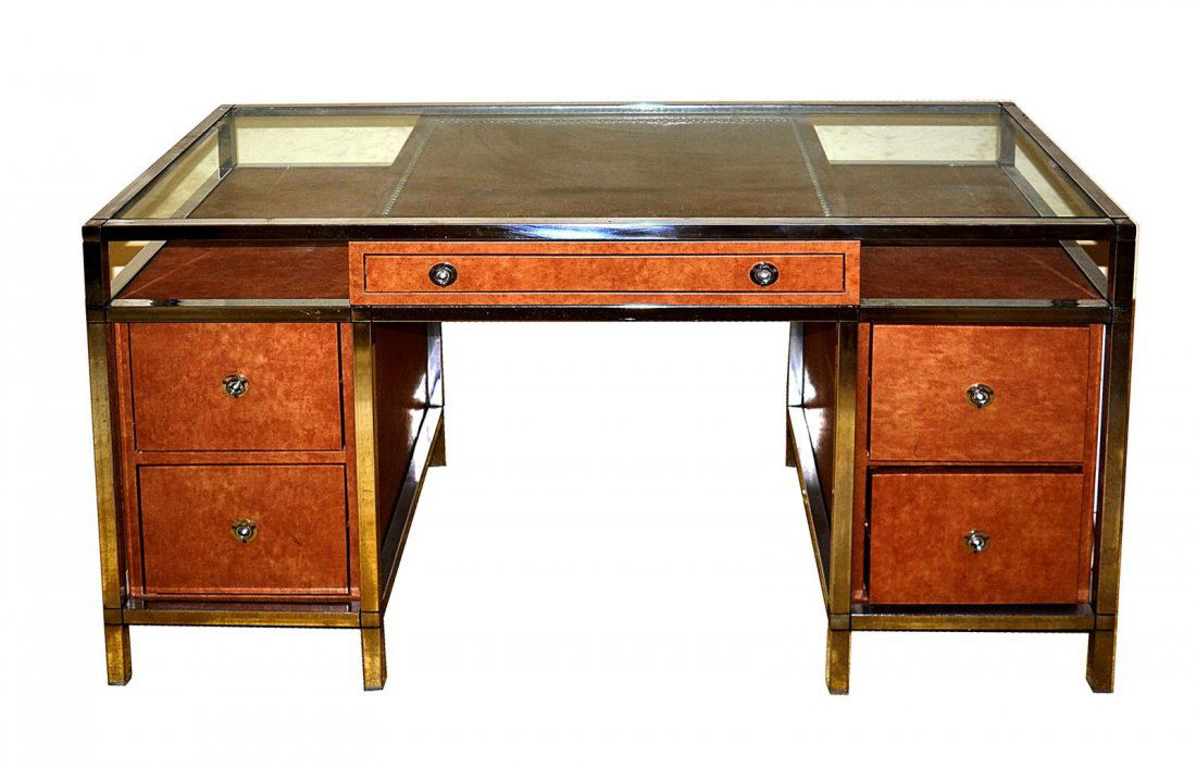 Manner of Karl Springer Chrome and Leather Desk: Manner of Karl Springer glass top knee hole desk with center drawer flanked by two lower drawers at either side. Finished back. Features leather faux ostrich surface and circular latch pulls. In very