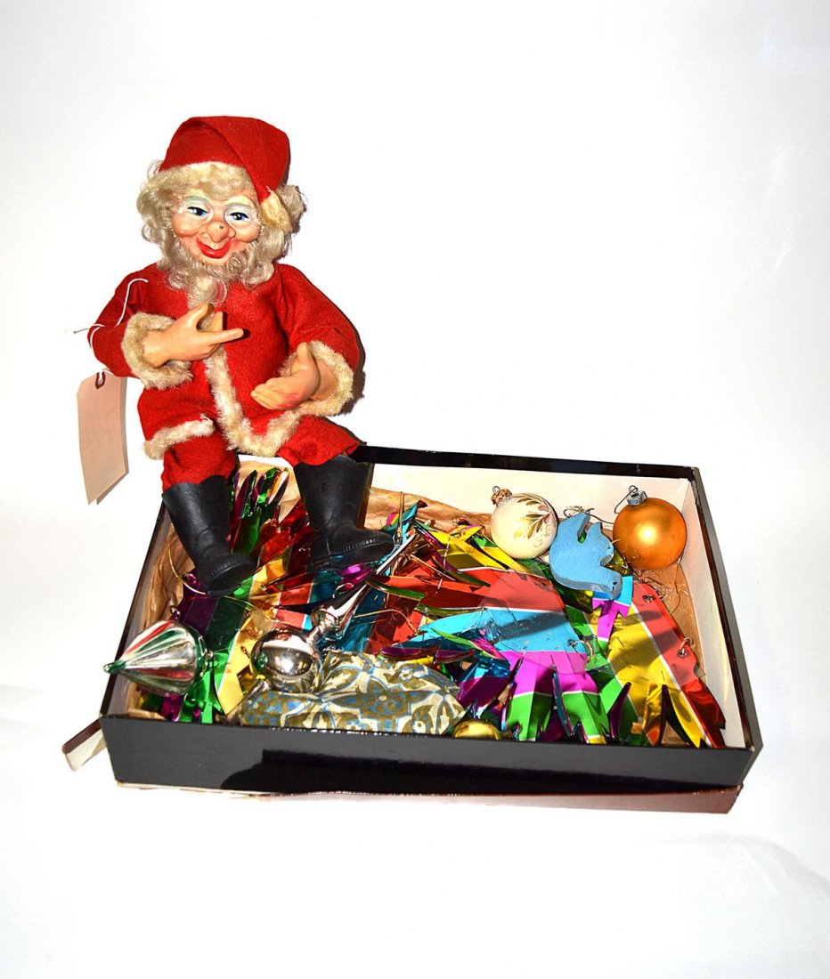 Group of Christmas Decorations: Including a stuffed Santa in drag with Tiffany box and Christmas balls. From the Estate of Arthur Laurents.