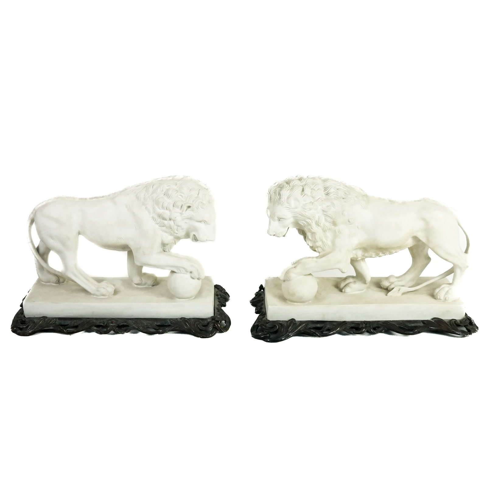 Pair of Parian Porcelain Medici Lions: Pair of Parian porcelain models of Medici lions, late 20th century, each with paw on a globe sphere, based on the Roman Albani lion in the collection of the Louvre Museum, Paris. [Overall: 8" H x 11 1