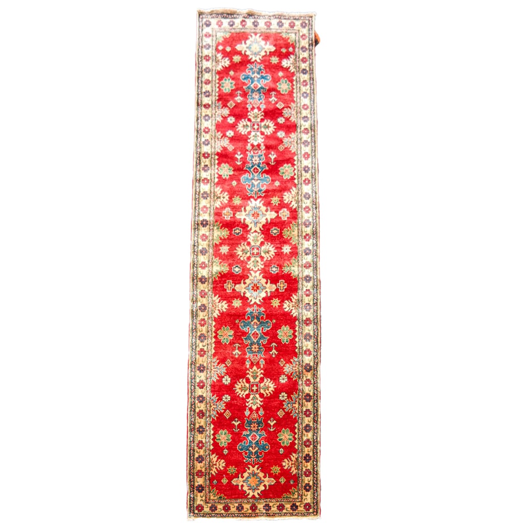 Oriental Runner: Oriental runner / rug, having a red ground with flower spaced border. [31" x 151"]. In good condition, with no tears or damage.