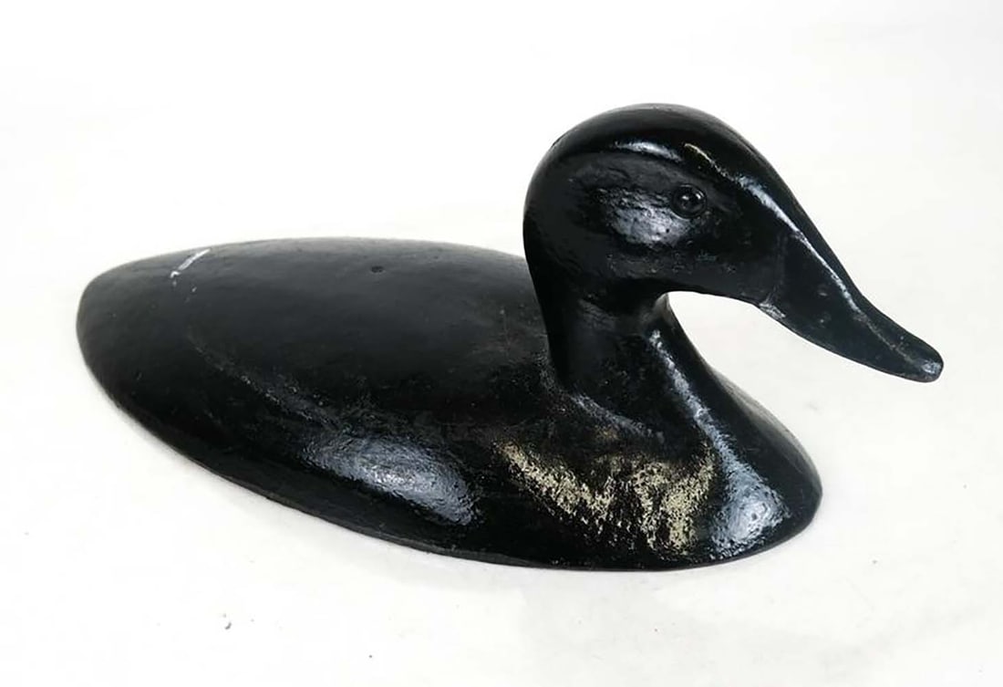 Canvasback Iron Sinkbox Weight: Canvasback iron sinkbox weight. Provenance: From Wildfowler Decoys, Inc. (Quogue) and Peacock Point, Long Island estate. [13 inches]. In good condition.