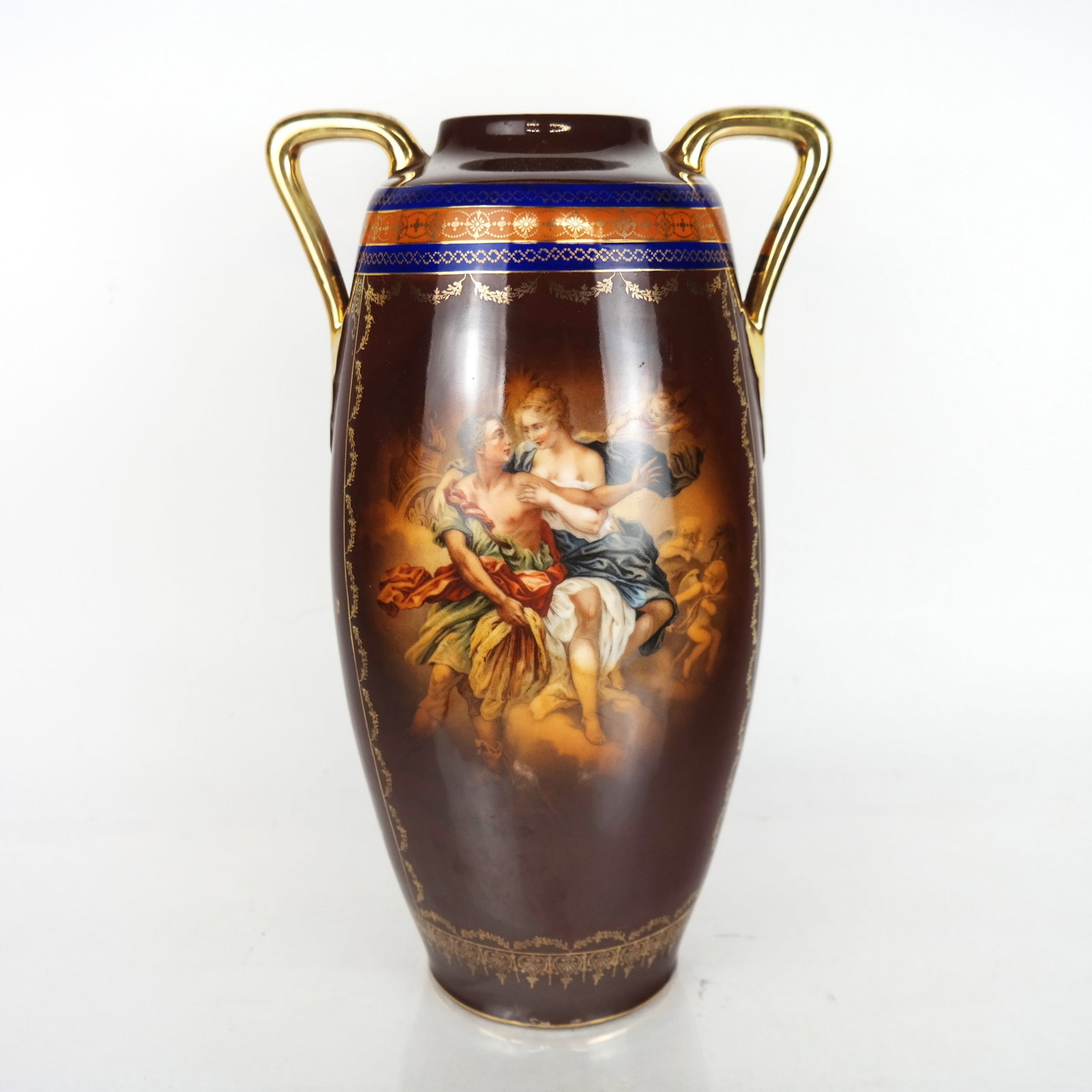 Bohemian Painted Porcelain Vase: Bohemia (Czech) paint-decorated porcelain vase, early 20th century, with gilt-accented decoration around an allegorical scene of a couple and putti among the clouds, marked to base "P & P'. [15 1/4" H