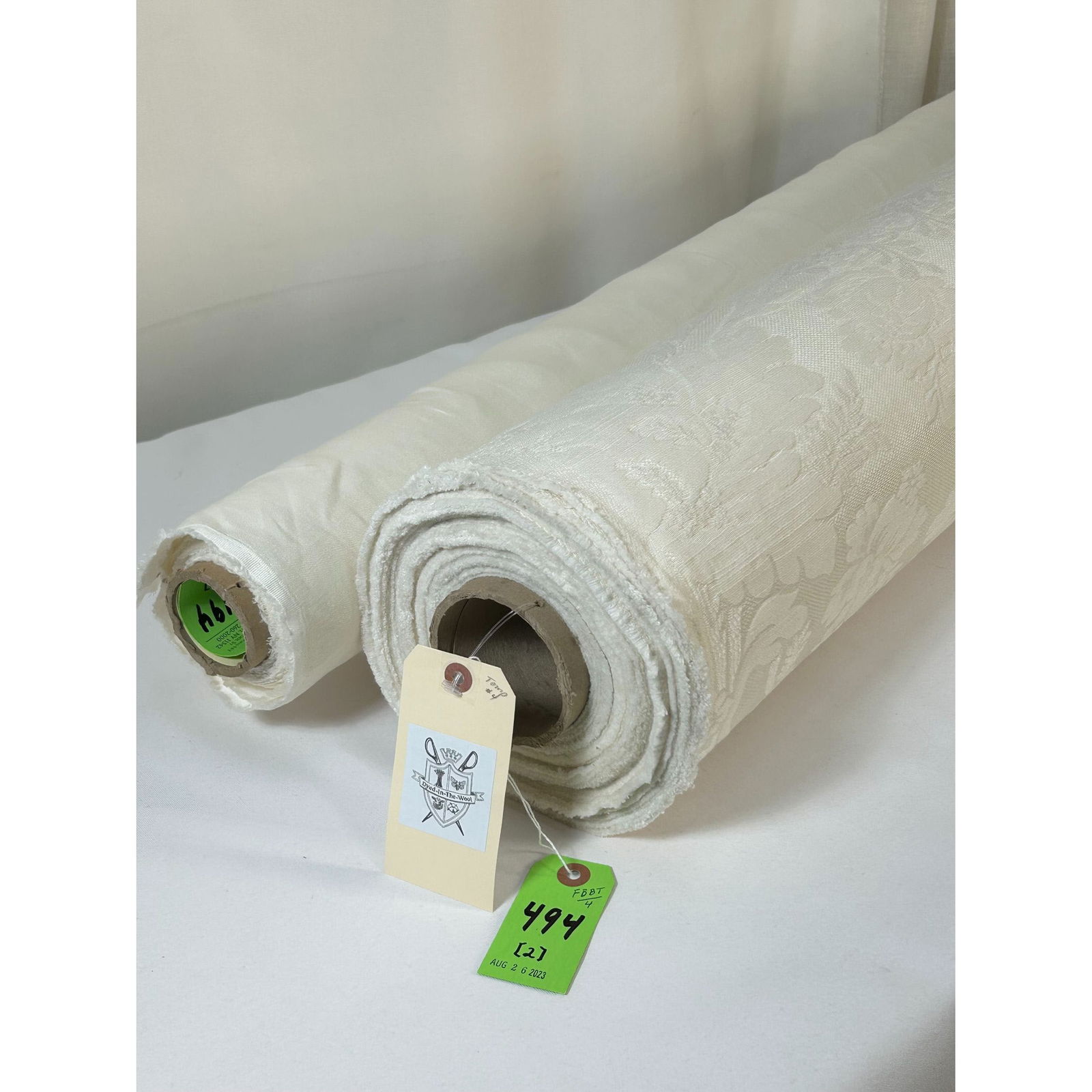 Italian Floral Denmark and Linen Satin Fabrics: 1) 20 1/2 gorgeous yards of Italian woven cotton and viscose upholstery damask in an adapted 18th century stylized floral. The white and ivory jacquard reveals a slight slub in the weft, a strie cotto