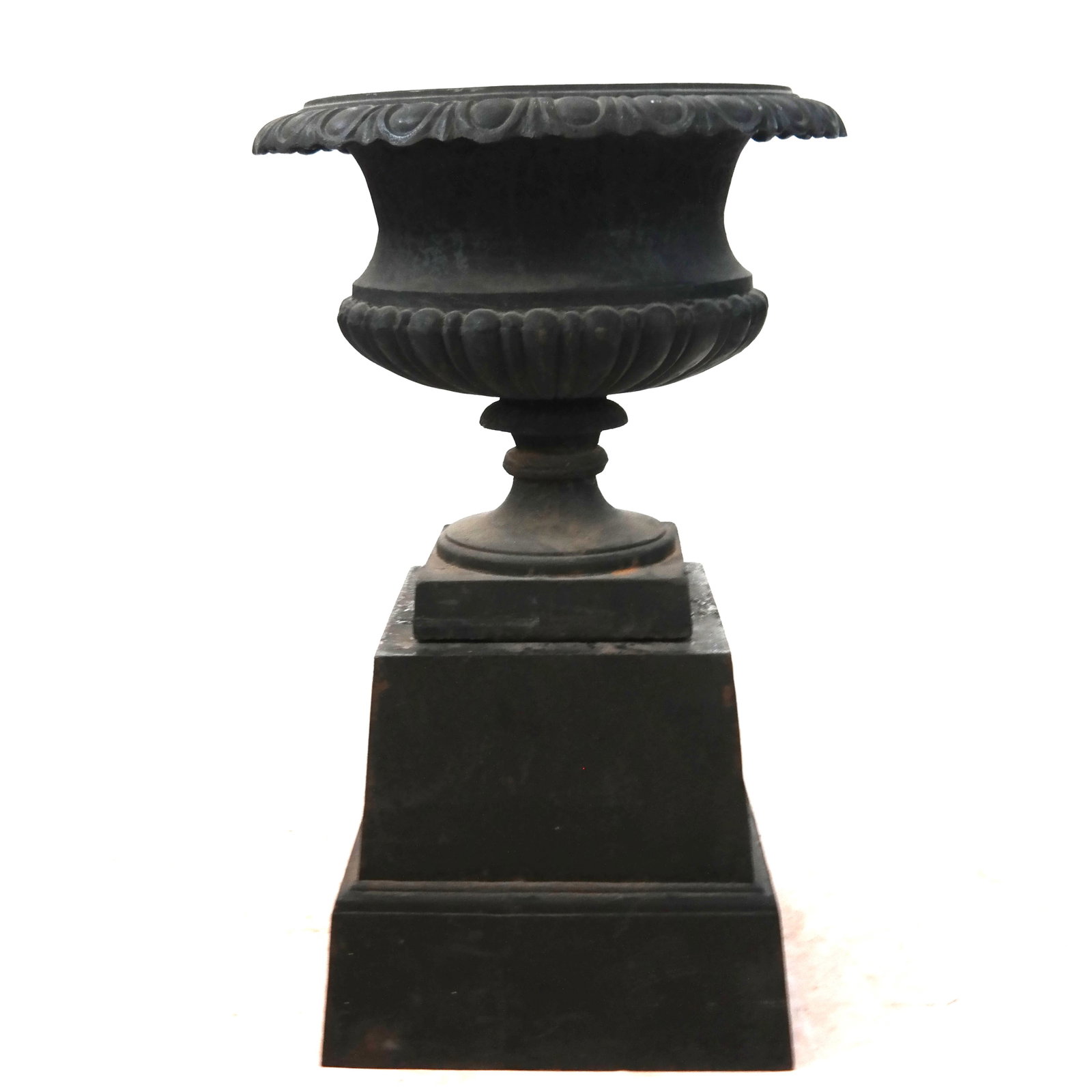 Classical-Style Cast Iron Garden Urn: Classical-style cast iron garden urn, after the antique, of campana form with flared rim and gadrooned with "egg and dart" border, raised on plinth base. [Overall: 32" H x 20" Diam.]. Areas of oxidati