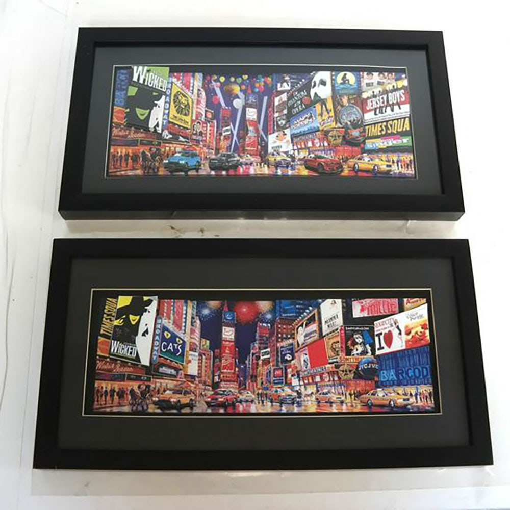 After ZHOU: Two Works on Paper: Two paper 3-d collages, depicting Times Square. Signature in picture. [Art: 5" H x 13" W; Frame: 9" H x 17" W]. In good condition.