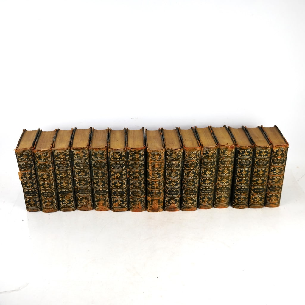 Scott's Works - 15 Volumes, Circa 1892: Sir Walter Scott (Scottish, 1771-1832) Limited Edition set of 15 volumes (incomplete), in three-quarter leather bindings with marbled boards. [8 1/2" H x 6" W]. Distressed condition.