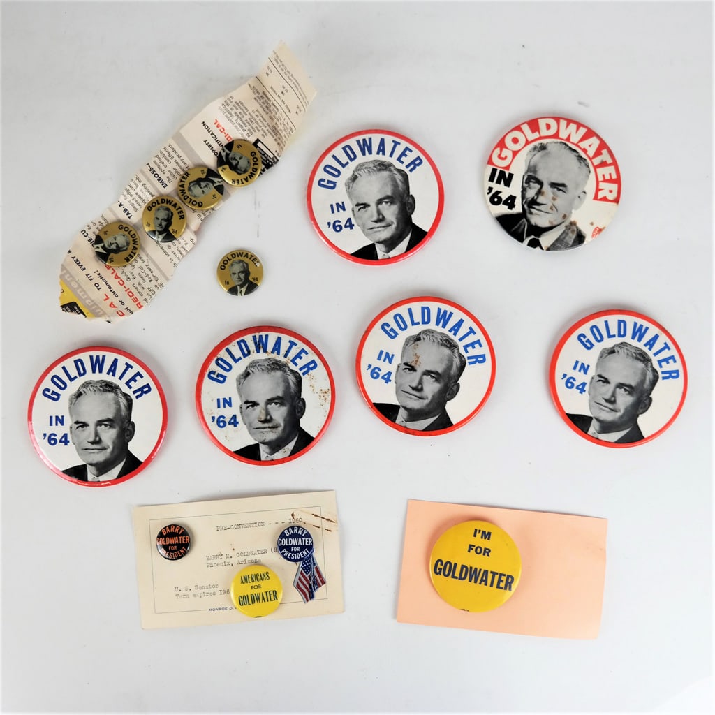 Barry Goldwater Campaign Buttons: Lot of Barry Goldwater campaign buttons, including a card from the collection of Monroe D. Ray. Provenance: From the Collection of Dr. Alan York. In good condition.