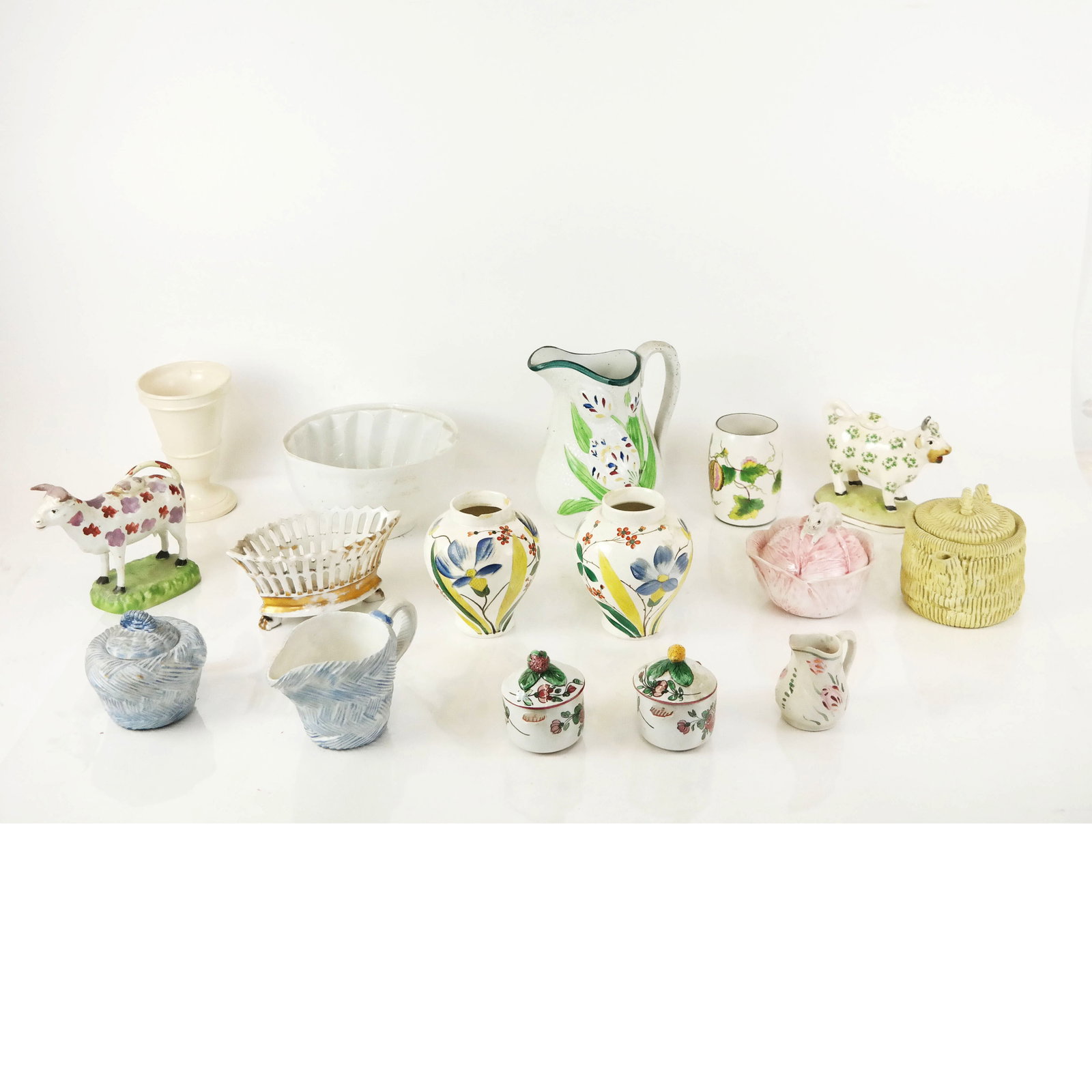 Assorted Italian Porcelains: Assorted Italian porcelains, including vases, pitchers, cows, teapot, and others. Provenance: From the Upper East Side, New York estate of a prominent Interior Designer. Some "as-is".
