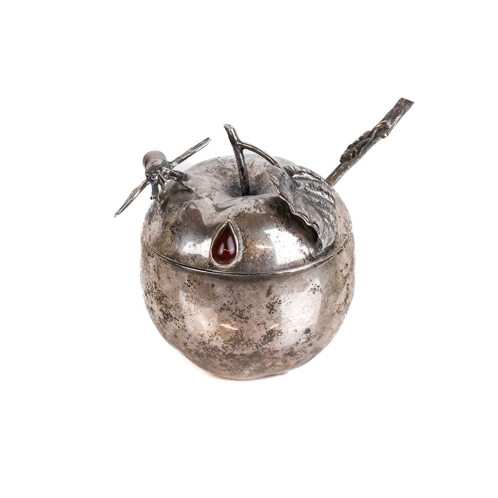 Sterling Silver Apple-Form Honey Jar: Sterling silver apple-form honey jar, with Hebrew letter inside for Rosh Hashana, having an insect mount with stones and a twig-form spoon. 11.3 ozt. inclusive. [3 1/2" H x 3" Diam.].