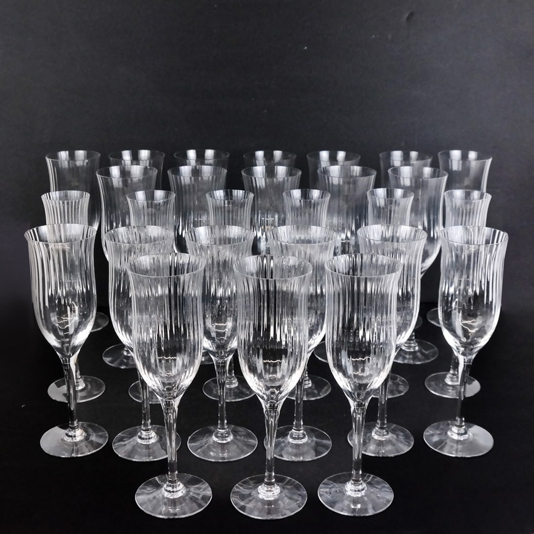 Orrefors Swedish Clear Stemware - 26 Pcs.: 26 pieces of Orrefors Swedish clear stemware in the Blanche Harmony pattern, including wine goblets, water glasses and champagne flutes, marked to bases. [Largest: 9 1/2" H x 2 7/8" Diam.].