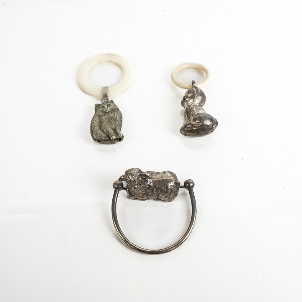 3 Silver Plate Baby Rattles/Teething Rings: One marked "EPNS." [Largest: 3 inches].