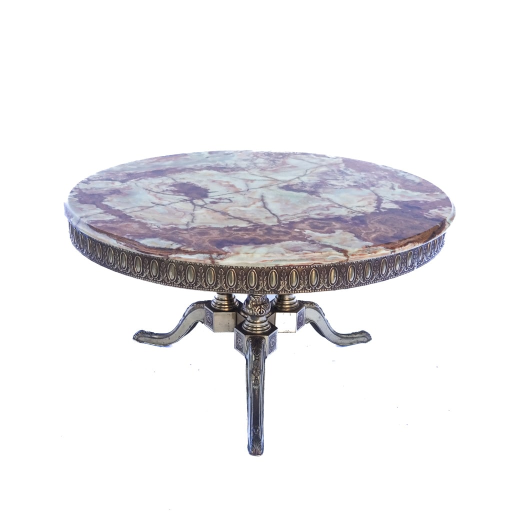 Hollywood Rgency Onyx Gilt Table: 20th century, round top and gallery with Rococo motifs. Raised on a tripod base. [18 1/2 x 34 1/2 diam. inches]. Marks and wear, light oxidation.