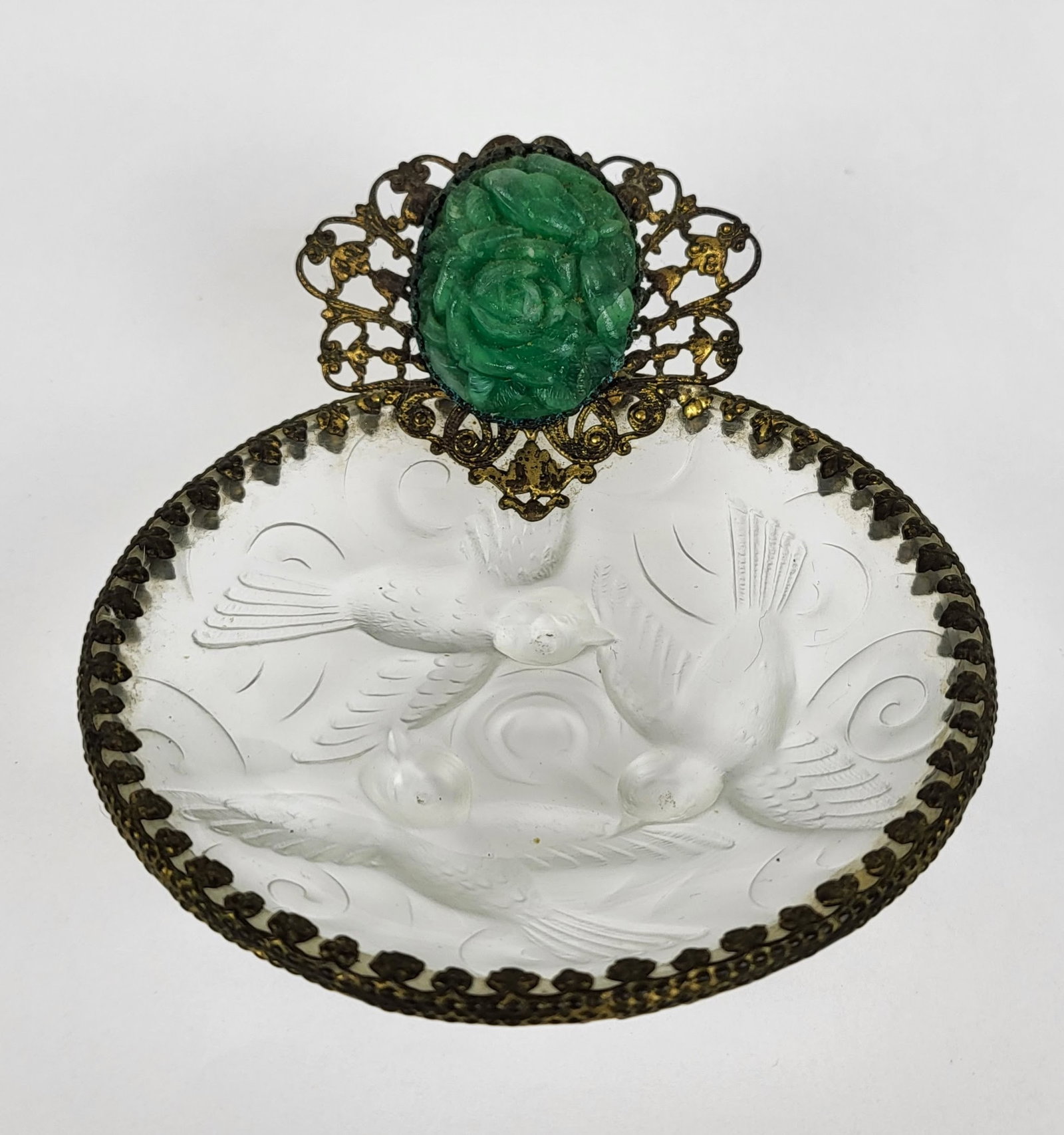 Gilt Metal Mounted Glass Bowl: Possibly French, with relief carved hardstone floral cabochon in jade-green over a frosted glass dish with relief decoration of birds in the manner of Lalique. Unsigned. Oxidation and bending to metal