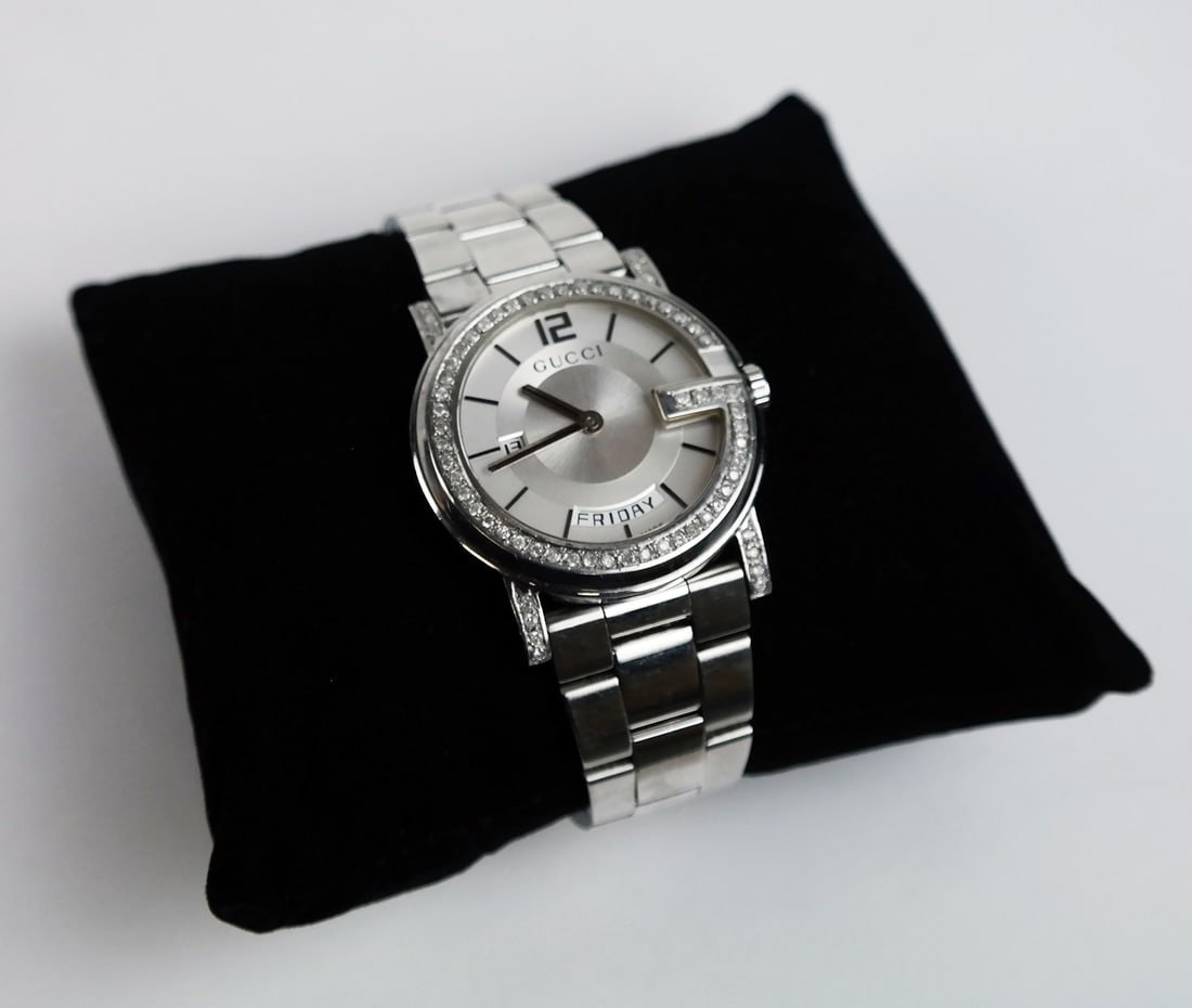 Gucci "101" Watch: Gucci "101" with day and diamond bezel.